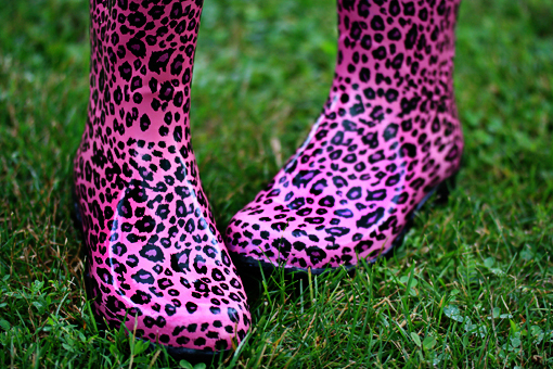 pink leopard wellington wellies boots on dark green grass