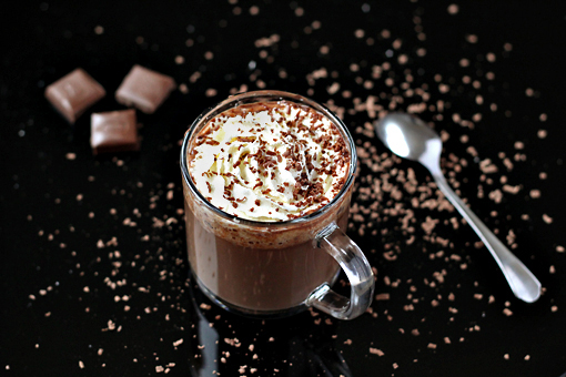 homemade hot chocolate recipe with step by step pictures, pour the chocolate into two cups and garnish with a dollop of whipped cream and some grated chocolate or a dusting of cocoa powder
