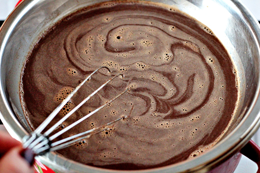 homemade hot chocolate recipe with step by step pictures, place the bowl over a pot of boiling and steaming water, stir until the chocolate melts, keep stirring until the mixture gets hot, nearly boiling