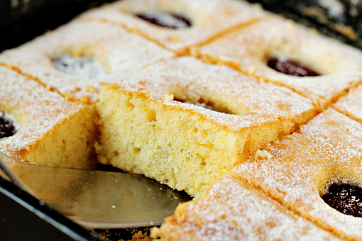 plum cake recipe with step by step picture tutorial, remove from the oven and let cool, then dust with a little confectioners' sugar and cut into squares