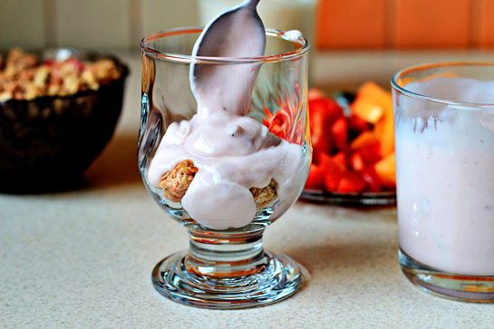 fruit yogurt parfaits recipe with step by step pictures, line up four glasses or parfait goblets, layer spoonfuls of granola, yogurt, and fruit until the glasses are full