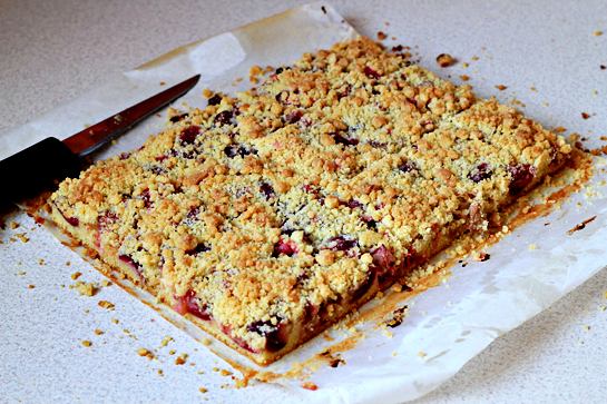 rhubarb and cherry crumb bars step by step picture recipe, using the paper overhand, lift your cake from the pan and cut into bars