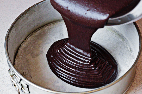 Chocolate Cake With Chocolate Buttercream Frosting, Line the bottom of a 9 x 2-inch (23 x 5 cm) springform pan or a round baking pan with parchment paper. Grease it and dust it with flour, Pour the cake mixture into the pan