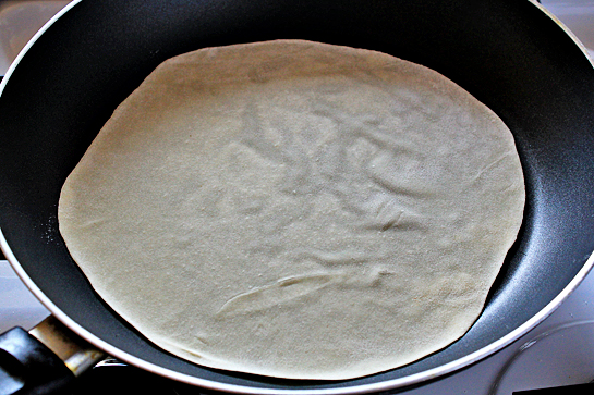 homemade tortillas recipe with step by step picture instructions, preheat a large skillet or a frying pan over medium-high heat, place a tortilla on the pan and let it cook for about 30 seconds, no oil or butter is needed, there's enough fat in the dough