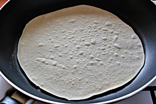 homemade tortillas recipe with step by step picture instructions, how to make homemade flour tortillas, after 30 seconds, flip the tortilla over and cook another 20 seconds