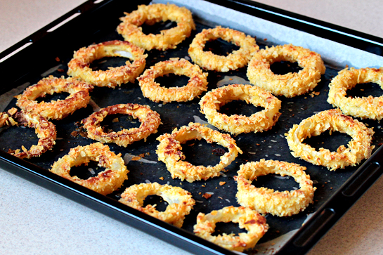 oven-fried onion rings with potato chips coating, recipe with step by step pictures, baked oven fried-onion rings on a baking sheet removed from the oven