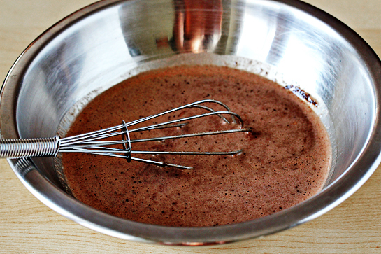 5-minute-mug-cake-mixed-batter-in-a-bowl-about-to-be-poured-in-a-mug