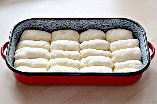 sweet jam filled buns in a baking pan