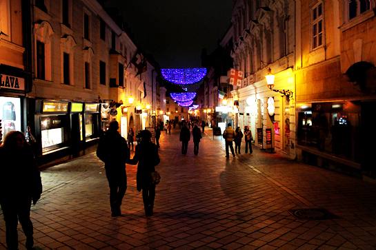 Christmas market street at night with Christmas lights