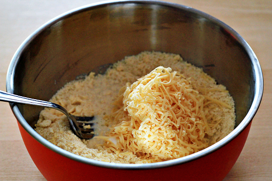 Garlic and cheese biscuits recipe with step by step pictures. Flour, garlic and salt in a bowl, Add milk. Add shredded cheese.