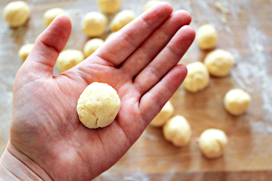 Garlic and cheese biscuit recipe with step by step pictures. Forming balls out of the even dough pieces.