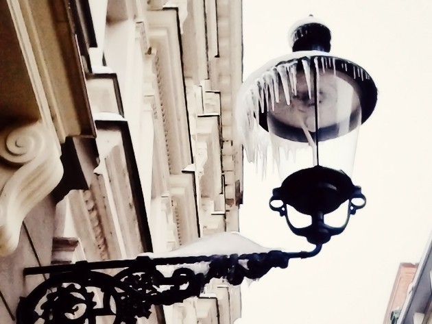 a walk in city centel old street lamp with icicles
