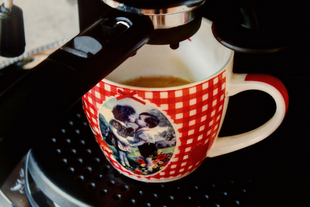 red mug and espresso machine