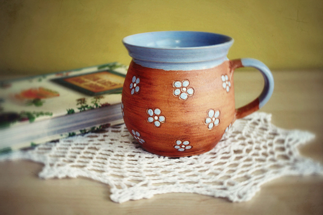 blue handmade mug with small flowers